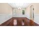 Dining room with hardwood floors and classic wainscoting at 347 Country Mill Way, Fuquay Varina, NC 27526