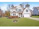 Beautiful two-story home with a well-kept lawn and an attached two-car garage at 347 Country Mill Way, Fuquay Varina, NC 27526