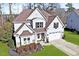 Charming two-story home with a manicured lawn, two-car garage and inviting front porch at 347 Country Mill Way, Fuquay Varina, NC 27526