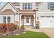 Inviting front porch with rocking chairs and stone accents, enhancing curb appeal at 347 Country Mill Way, Fuquay Varina, NC 27526