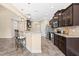 Open kitchen with breakfast bar, stainless steel appliances and granite countertops at 347 Country Mill Way, Fuquay Varina, NC 27526