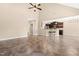 Open living space with kitchen, breakfast bar, and tile flooring at 347 Country Mill Way, Fuquay Varina, NC 27526