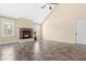 Bright living room with vaulted ceiling, fireplace, and tile flooring at 347 Country Mill Way, Fuquay Varina, NC 27526