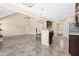 Open concept living room featuring a kitchen bar, tile floors, and recessed lighting at 347 Country Mill Way, Fuquay Varina, NC 27526