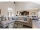 Open concept living room with sectional sofa, kitchen, and dining area at 347 Country Mill Way, Fuquay Varina, NC 27526