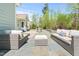 Back patio with stone pavers and outdoor furniture at 347 Country Mill Way, Fuquay Varina, NC 27526