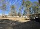 Spacious backyard with trees and a screened porch at 364 Appaloosa Dr, Spring Lake, NC 28390