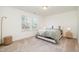 Well-lit bedroom with a queen bed and neutral tones at 370 Hickory Run Ln, Franklinton, NC 27525