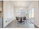 Breakfast nook with a round table and four chairs, near a sliding glass door at 370 Hickory Run Ln, Franklinton, NC 27525