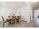 Bright dining room with wood-look floors and seating for six at 370 Hickory Run Ln, Franklinton, NC 27525