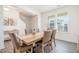 Bright dining room with a wood table and six chairs, plus access to the kitchen at 370 Hickory Run Ln, Franklinton, NC 27525