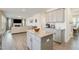 Kitchen island with granite countertop and ample storage, overlooking living room at 370 Hickory Run Ln, Franklinton, NC 27525
