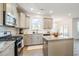 Modern kitchen featuring granite countertops and stainless steel appliances at 370 Hickory Run Ln, Franklinton, NC 27525
