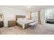 Spacious main bedroom with king-size bed and large windows at 370 Hickory Run Ln, Franklinton, NC 27525
