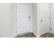 Front entry with white door, wood-look flooring, and neutral walls at 408 Honeycutt Oaks Dr, Angier, NC 27501