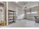 Garage interior with shelving and overhead door at 431 Leighann Ridge Ln, Rolesville, NC 27571