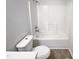 Clean bathroom with a white bathtub, toilet, and tile flooring at 4532 Hidden Hollow Ln, Knightdale, NC 27545