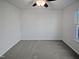 Well lit bedroom with carpet and window at 4532 Hidden Hollow Ln, Knightdale, NC 27545