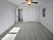 Well-lit bedroom with plush carpeting and built-in closet at 4532 Hidden Hollow Ln, Knightdale, NC 27545