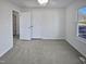 Spacious bedroom with double doors and window at 4532 Hidden Hollow Ln, Knightdale, NC 27545