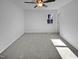Well-lit bedroom featuring carpet and ceiling fan at 4532 Hidden Hollow Ln, Knightdale, NC 27545