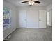 Spacious bedroom with large window and ceiling fan at 4532 Hidden Hollow Ln, Knightdale, NC 27545