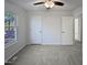 Spacious bedroom with carpet, ceiling fan and window at 4532 Hidden Hollow Ln, Knightdale, NC 27545