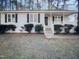 Ranch style home with front porch and well-manicured lawn at 4532 Hidden Hollow Ln, Knightdale, NC 27545