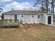 Rear view of house showing deck and fenced backyard at 4532 Hidden Hollow Ln, Knightdale, NC 27545