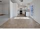 Modern kitchen with white cabinets and tile floor at 4532 Hidden Hollow Ln, Knightdale, NC 27545