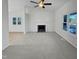 Spacious living room featuring a fireplace and ample natural light at 4532 Hidden Hollow Ln, Knightdale, NC 27545