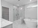 Luxurious bathroom with marble shower, soaking tub, and modern fixtures at 4809 Bristol Meadow Dr, Raleigh, NC 27603