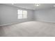 Spacious bonus room with carpeted floor and neutral color palette at 4809 Bristol Meadow Dr, Raleigh, NC 27603