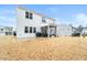 Home's backyard features a screened porch, patio, and grassy area at 53 Albereto Dr, Clayton, NC 27527