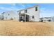 Home's backyard features a screened porch, patio, and grassy area at 53 Albereto Dr, Clayton, NC 27527