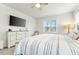Spacious bedroom with large bed, dresser, and window at 53 Albereto Dr, Clayton, NC 27527