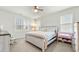Bright bedroom featuring a king-size bed and a crib at 53 Albereto Dr, Clayton, NC 27527