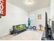 Bonus room with a sofa, chairs and a TV at 53 Albereto Dr, Clayton, NC 27527
