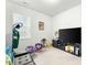 Spacious bonus room with a large TV and seating at 53 Albereto Dr, Clayton, NC 27527