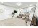 Bonus room featuring a sectional sofa and large mirror at 53 Albereto Dr, Clayton, NC 27527