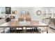Bright dining area with a large wooden table and access to the backyard at 53 Albereto Dr, Clayton, NC 27527
