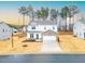Two-story house with brick and white siding, a two-car garage, and a landscaped yard at 53 Albereto Dr, Clayton, NC 27527