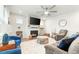 Cozy living room with fireplace, comfortable seating, and a large TV at 53 Albereto Dr, Clayton, NC 27527