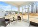 Relaxing screened porch overlooking the backyard with wicker furniture at 53 Albereto Dr, Clayton, NC 27527