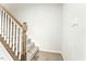 Elegant staircase with carpeted steps and wooden railing at 53 Albereto Dr, Clayton, NC 27527