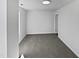 Simple bedroom with grey carpet and ample natural light at 5340 Fayetteville Rd, Durham, NC 27713