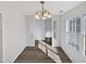 Bright dining room features hardwood floors and a chandelier at 5340 Fayetteville Rd, Durham, NC 27713
