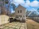 Two-story house exterior with backyard patio and storage shed at 5340 Fayetteville Rd, Durham, NC 27713