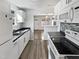 Modern kitchen with white cabinets and breakfast bar at 5340 Fayetteville Rd, Durham, NC 27713