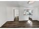 Spacious living room with hardwood floors and kitchen view at 5340 Fayetteville Rd, Durham, NC 27713